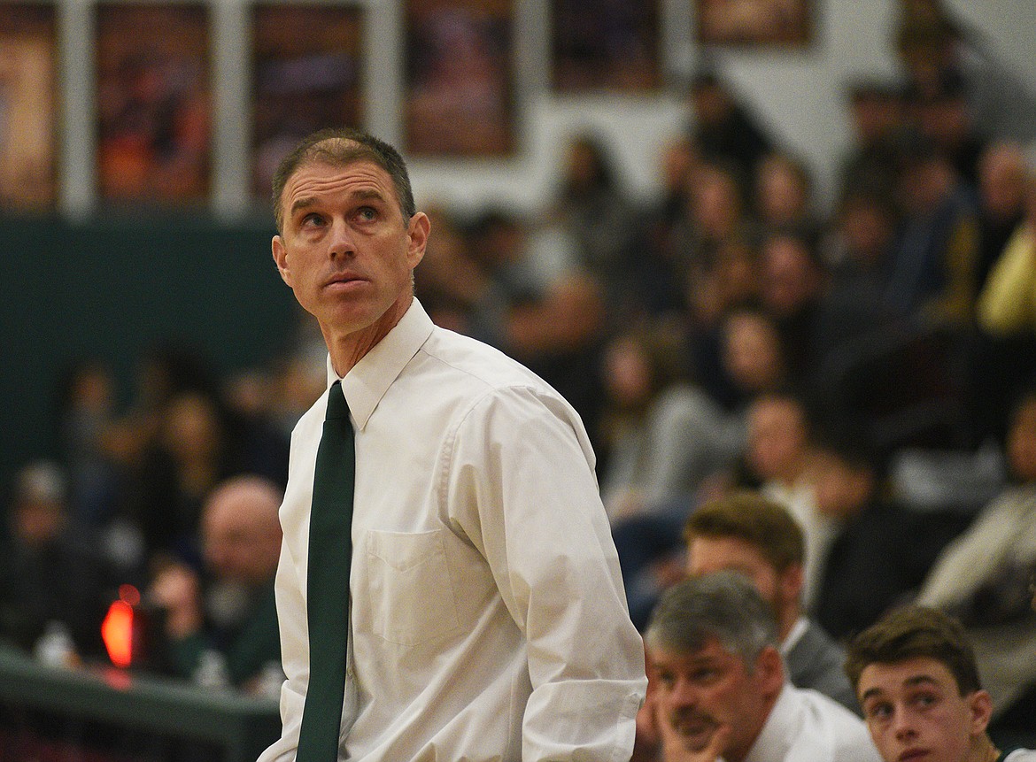 Head coach Scott Smith checks the game clock with minutes left in overtime in Whitefish&#146;s tournament win over Ronan Saturday morning. (Daniel McKay/Whitefish Pilot)