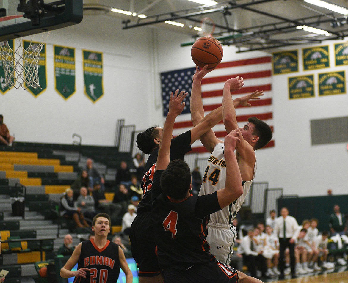 Lee Walburn drives to the basket for two of his 26 points in Whitefish&#146;s tournament win over Ronan Saturday morning. (Daniel McKay/Whitefish Pilot)