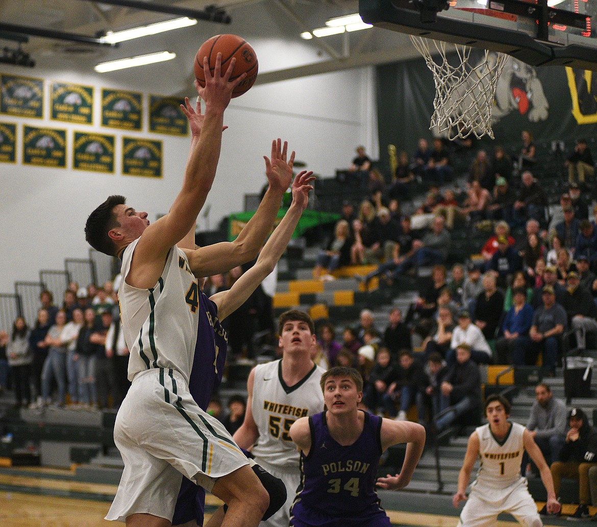 Lee Walburn streaks through the lane during Friday night&#146;s battle with Polson at the Northwest A District Tournament. (Daniel McKay/Whitefish Pilot)