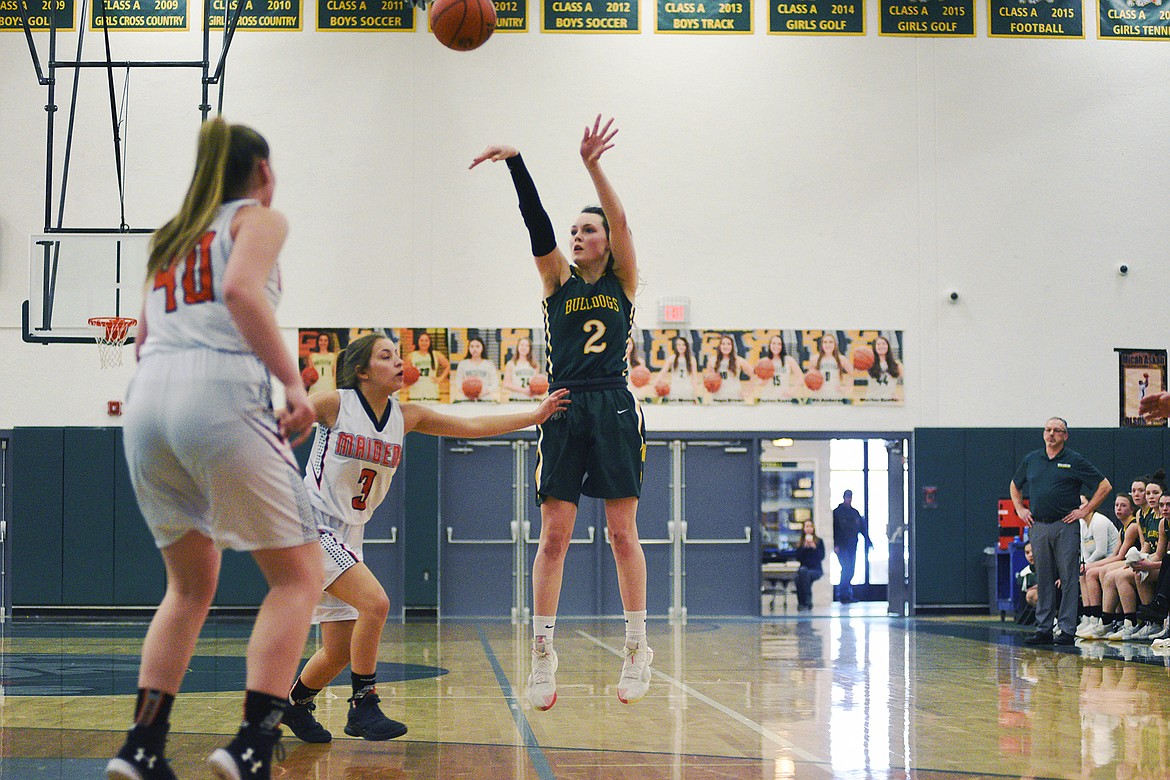Kaiah Moore launches a wing jumper against Ronan in the Class A District Tournament on Saturday. (Daniel McKay/Whitefish Pilot)