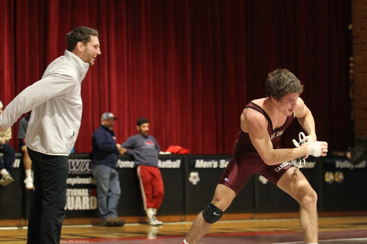 JASON ELLIOTT/Press
North Idaho College interim wrestling coach Brandon Richardson congratulates Cooper McCullough after McCullough&#146;s win at 157 pounds in the West District championships on Sunday at Christianson Gymnasium.