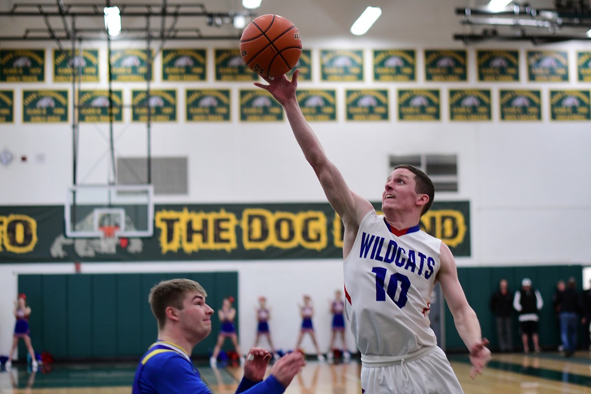 Wildcat Dillon Wanner goes up for a shot in the first half against Libby Saturday. (Jeremy Weber photo)