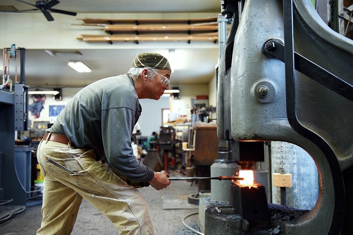 Jeffrey Funk forges at a Chambersburg utility hammer in his shop near Bigfork on Wednesday, Feb. 6. (Casey Kreider/Daily Inter Lake)
