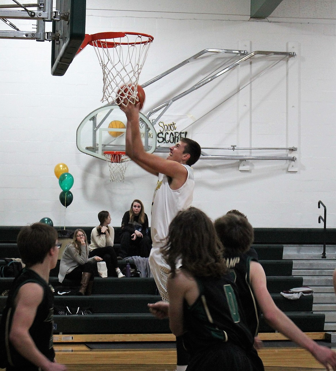 Senior JD Booker hits a shot during his final home game last Saturday in St. Regis against the Lincoln Lynx. The Tigers won, 66-24. (Kathleen Woodford/Mineral Independent)