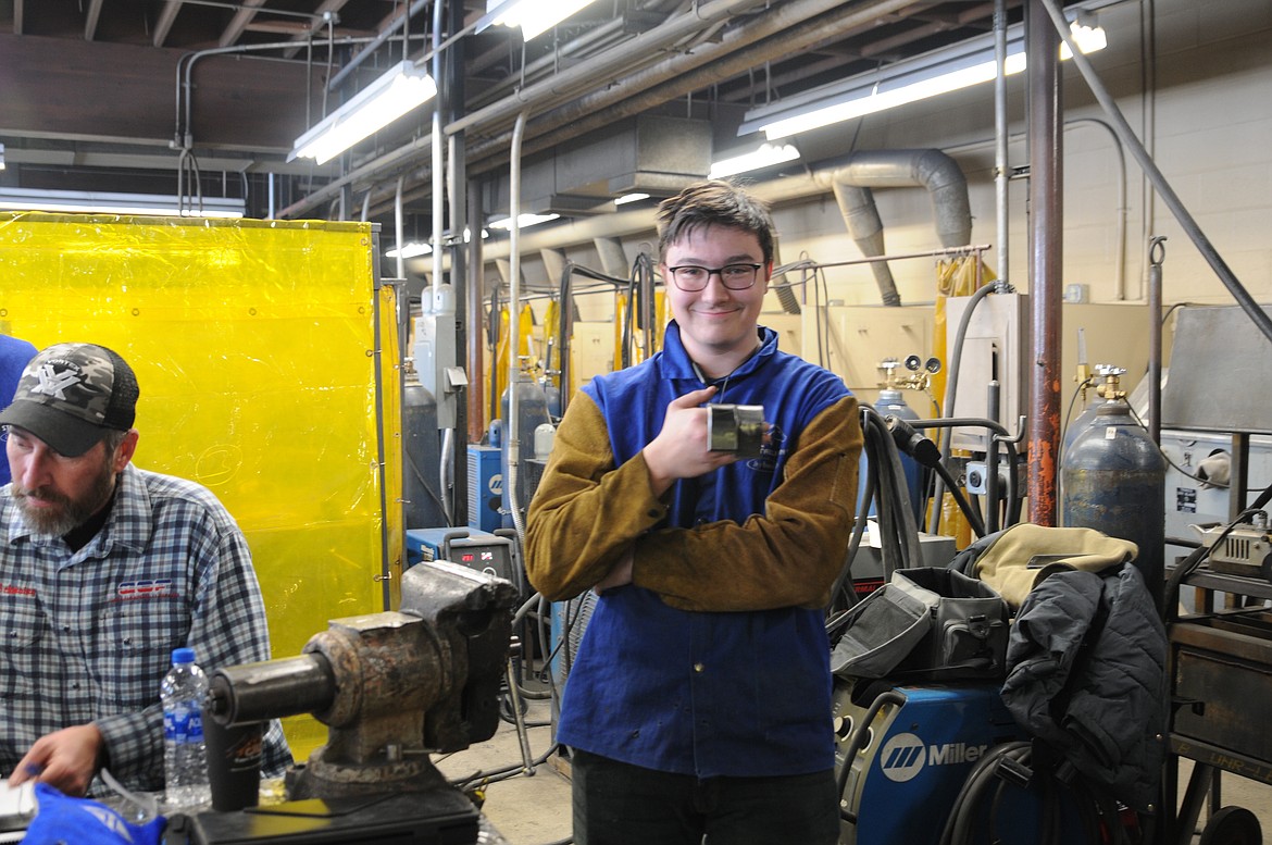 Libby GRADE  Joe Downard holds up his welding &quot;coupon&quot; during certification testing at Libby High School Friday. (Rima Austin/The Western News)