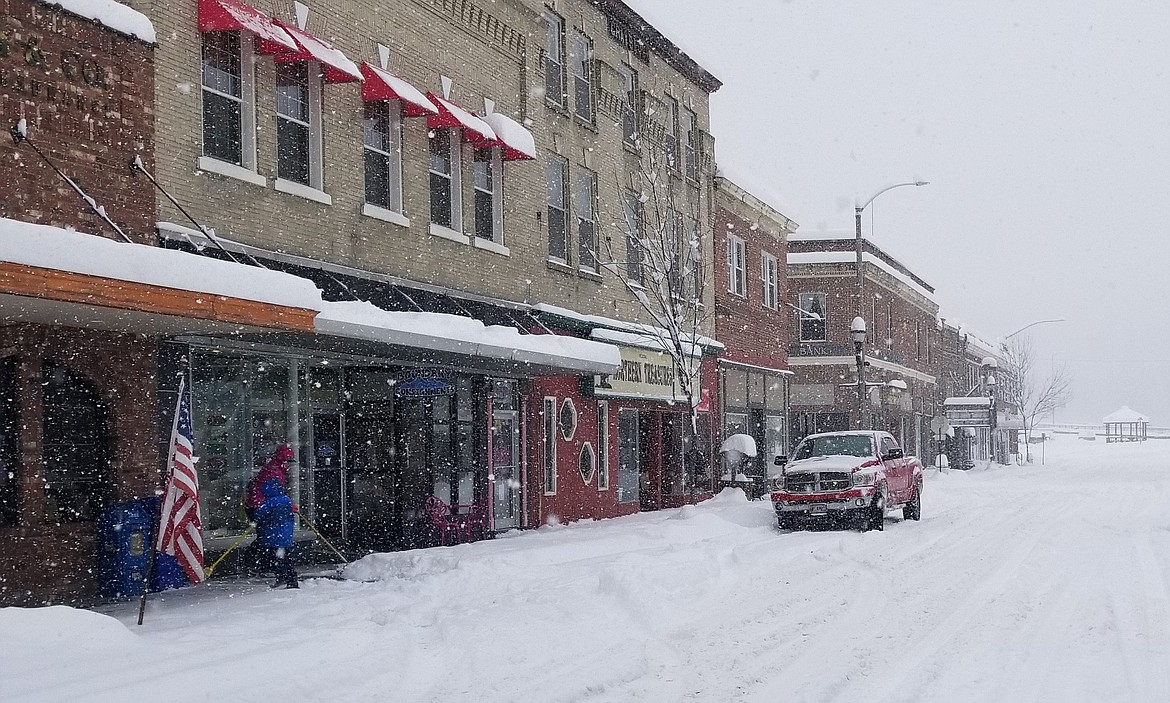 Photo by MANDI BATEMAN
Tuesday morning found businesses out shoveling the sidewalks, only to have them buried again a short time later.