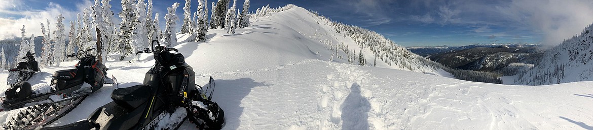 Photo by CASEY CAVENDER
Enjoying winter by snowmobiling up Trestle Creek.