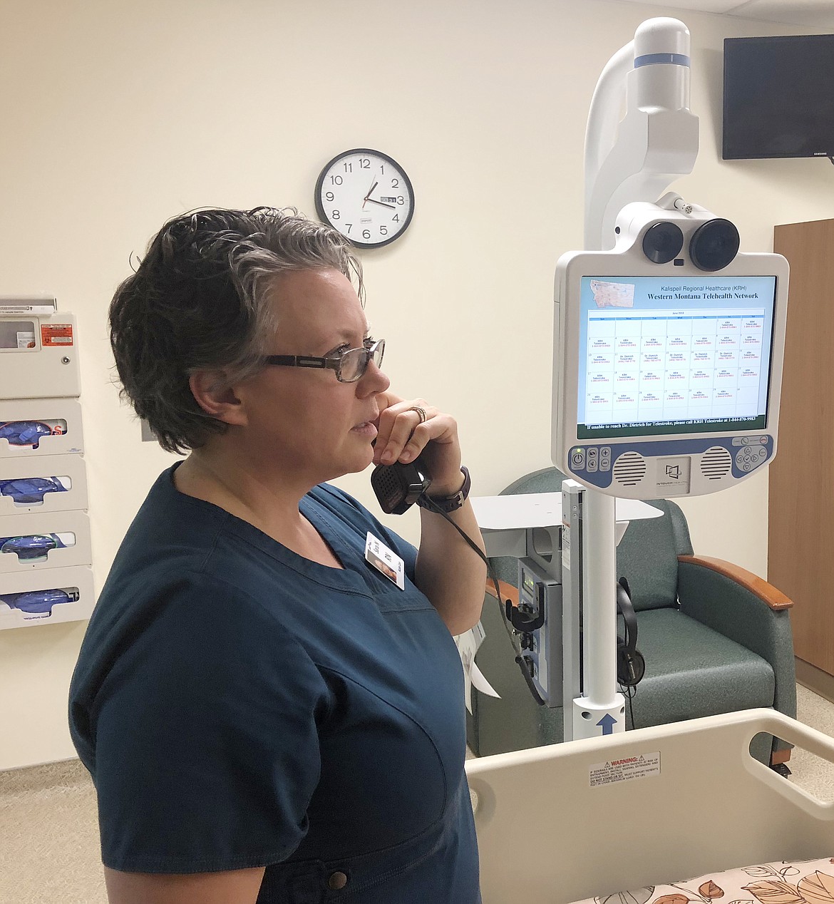 SARA NESTOR, RN, at Clark Fork Valley Hospital is pictured calling a telestroke specialist. (Photo courtesy of Clark Fork Valley Hospital)