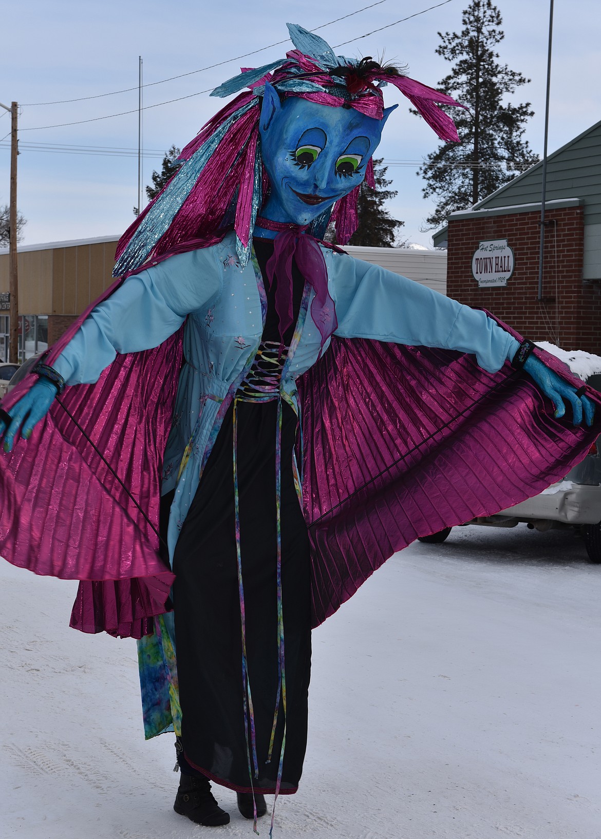 YOU'D NEVER know it, but it's Becky Luther inside a costume that appears to be an overgrown genie during the Chinese New Year Parade. She was about 10 feet tall.