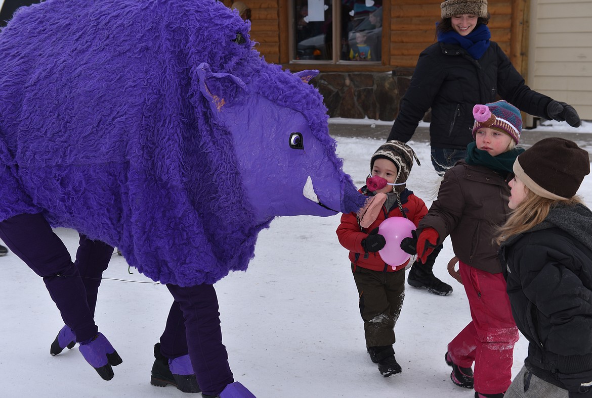 ONE OF the entries in the Chinese New Year Parade last Saturday in Hot Springs was a purple boar, since it&#146;s the Year of the Boar, with organizer Linny Gibson inside. (Joe Sova photos/Clark Fork Valley Press)