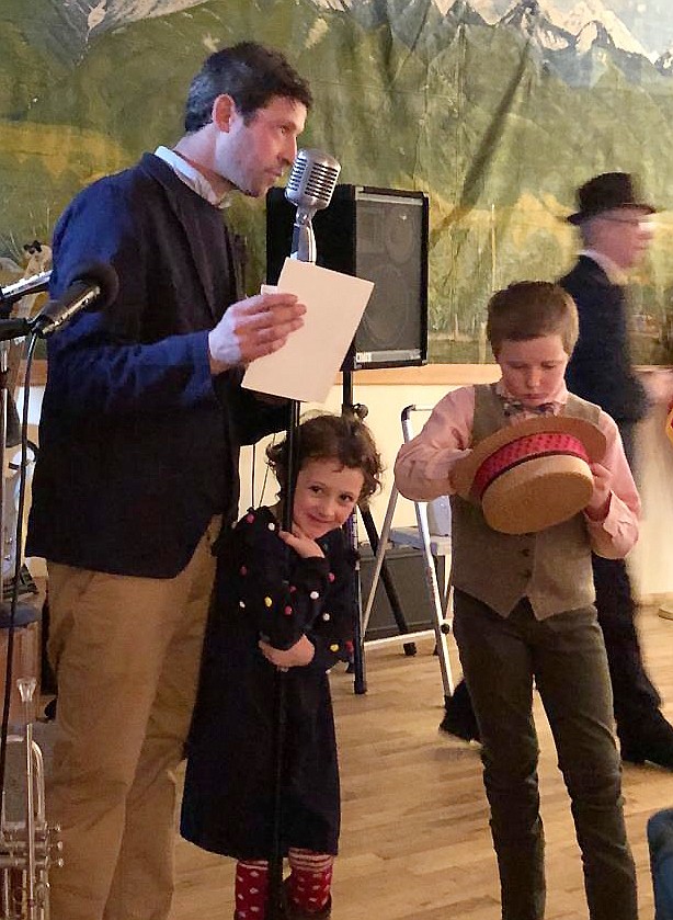 NAG BOARD member Ben Ferenz enlists youthful help drawing for raffle prizes at the annual Valentine fundraiser, with KC of the Valley Cats.