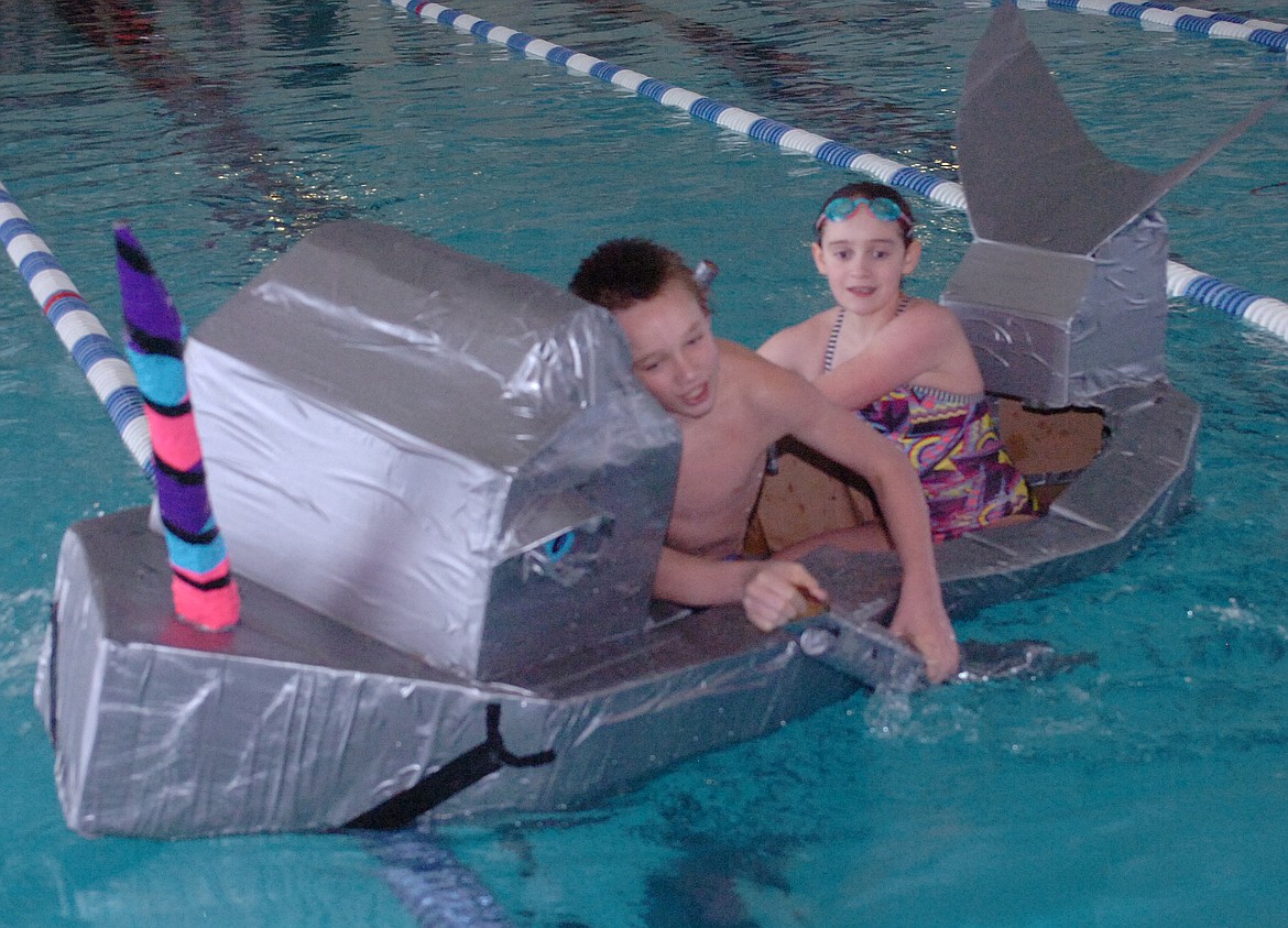 The lane dividers proved to be an obstacle for The Narwahls team during a race-off against The Revenge to conclude a Polson Middle School sixth-grade STEAM event. Above, Hunter Lytton and Dixie Montgomery paddle hard to right the ship.