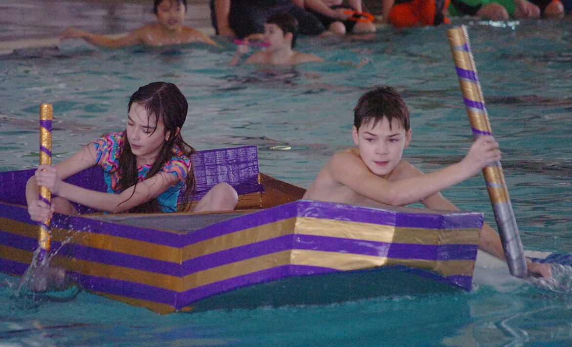 The Revenge advisory team members Jazmyn Paul and Seth Ingram paddle toward the finish line during a race-off against The Narwhals. The Revenge boat covered the 25-yard distance in 45 seconds.