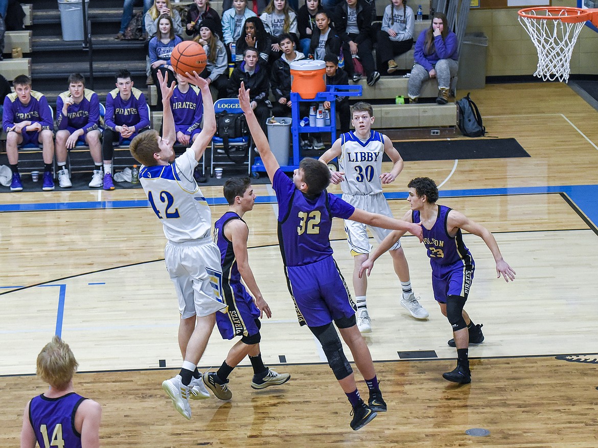 After the Logger offense drew the Pirate defense almost out to mid-court, Libby junior Keith Johnson shoots for two from the paint to give the Loggers an 11-3 lead in the first quarter Saturday against Polson. (Ben Kibbey/The Western News)