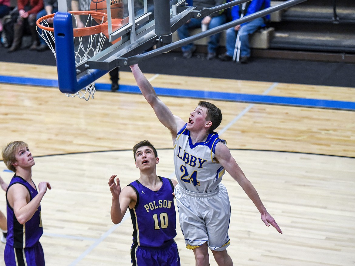 After fighting for an opening, Libby sophomore Jay Beagle puts in a layup early in the fourth quarter Saturday against Polson. (Ben Kibbey/The Western News)