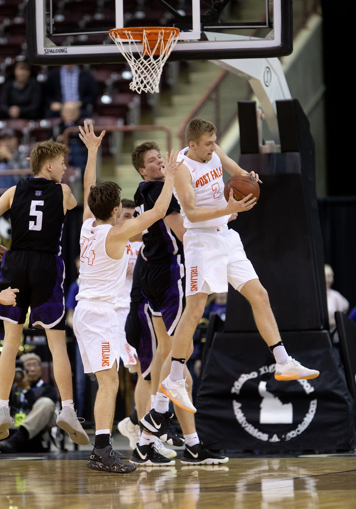 JASON DUCHOW/Jason Duchow Photography
Post Falls junior Colby Gennett secures  a defensive rebound vs Rocky Mountain during Thursday&#146;s game in Nampa.