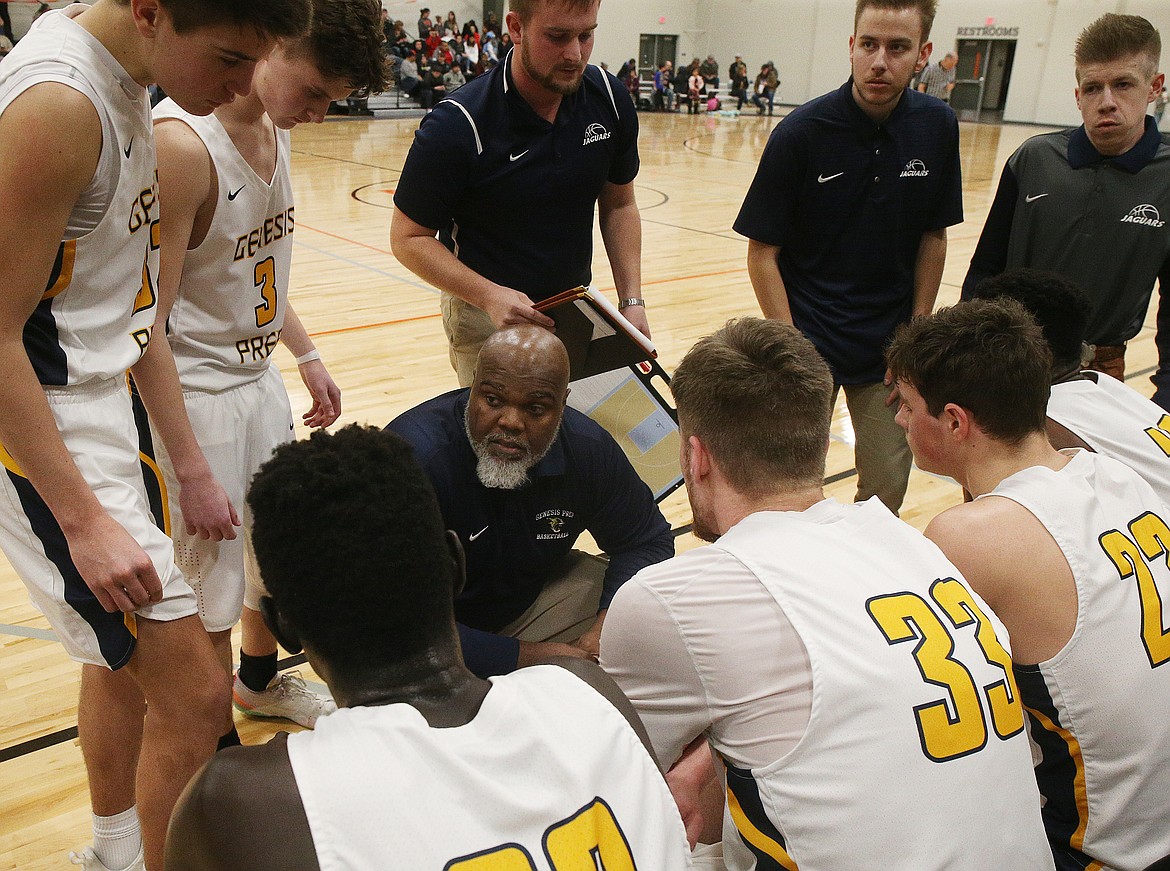 LOREN BENOIT/Press
Genesis Prep coach Marsell Colbert talks strategy with his players during a timeout in the 1A Division II District 1 championship game against Lakeside last Friday at The Courts at Real Life Ministries in Post Falls.