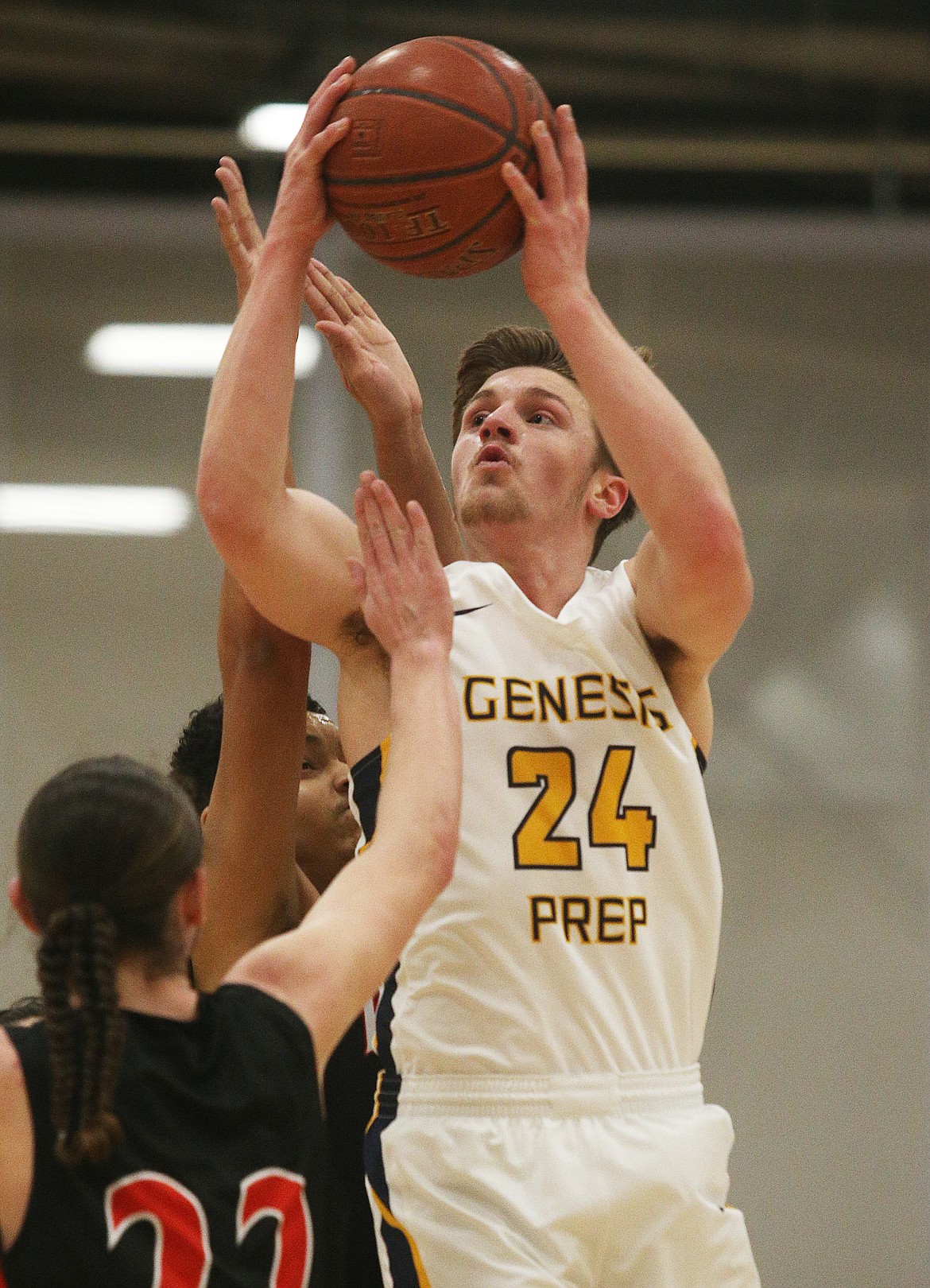 Jonny Hillman of Genesis Prep goes for a layup while defended by Lakeside&#146;s Jayson Hall.