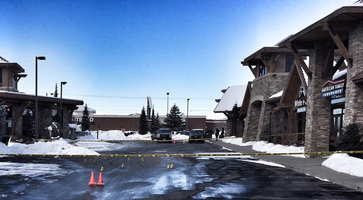 Crime tape lines the parking lot of Hayden Creek Plaza on Government Way in Hayden where Kootenai County Sheriff&#146;s deputies investigate an early morning fatal shooting involving patrons of the Tipsy Pine Bar. (Photos by RALPH BARTHOLDT/Press)