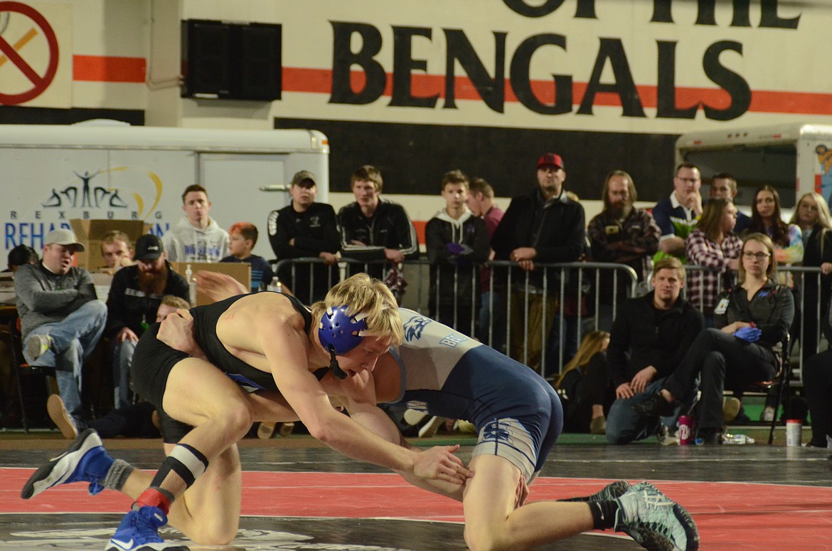 Photo by NORM and KELLY SEE
Payton Keough, left, of Coeur d&#146;Alene pinned Blake Beal of Skyview in the 5A 132-pound state wrestling finals at Holt Arena in Pocatello on Saturday.