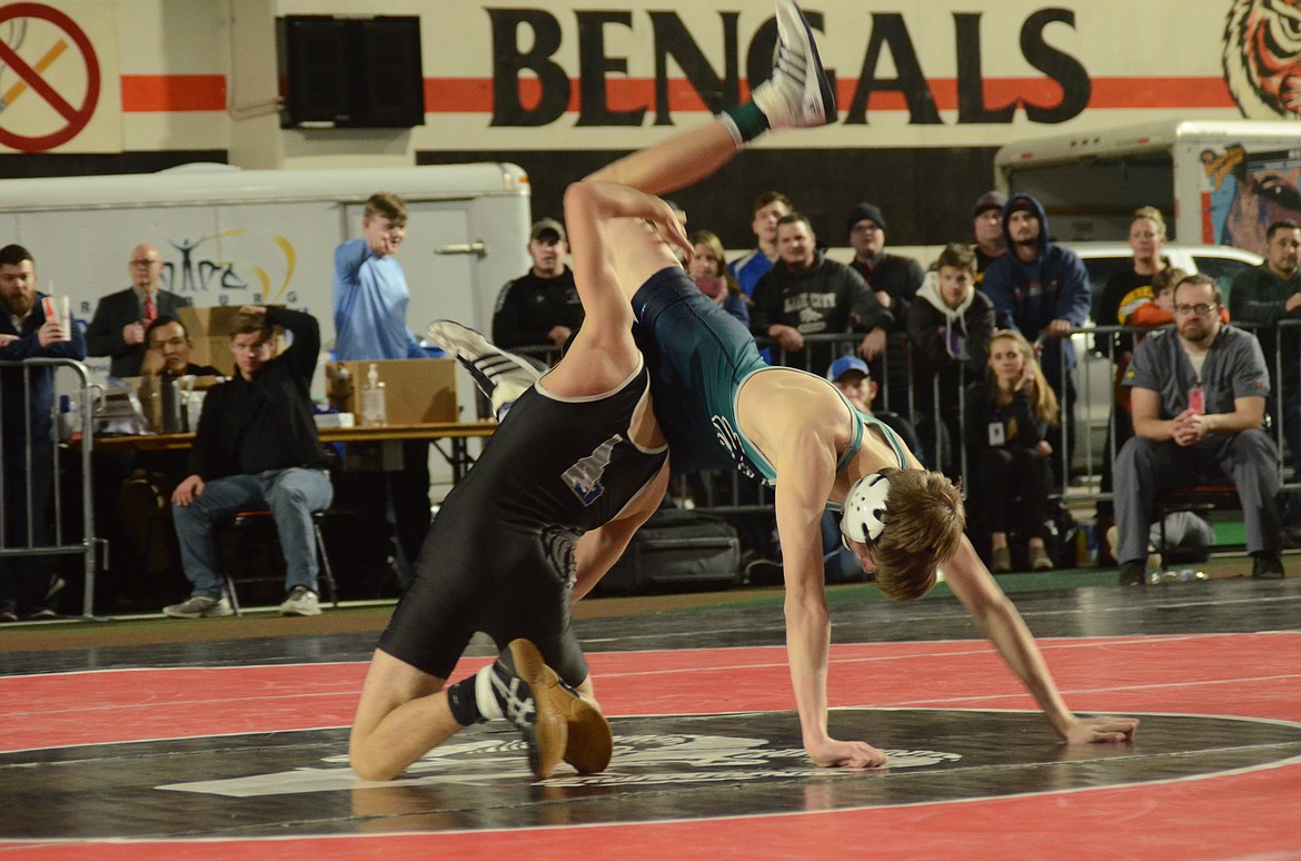 Photo by NORM and KELLY SEE 
Caden Hess, right, of Lake City, beat Edward Soto of Skyview 6-3 in the 5A 106-pound finals Saturday at Holt Arena in Pocatello.