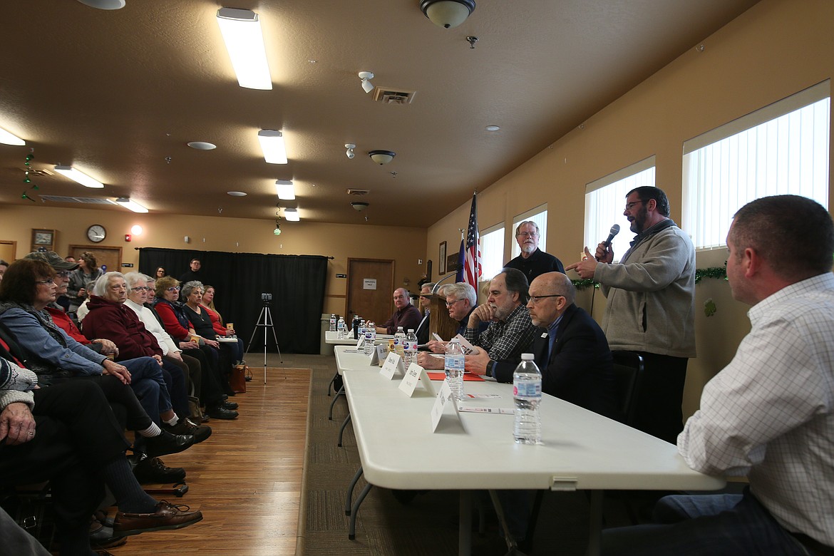 Rep. John Green, R-Post Falls, takes the mic Saturday morning during the Kootenai County Republican Central Committee town hall in the Post Falls Senior Center. About 100 people attended to hear legislators talk about topics such as abortion, wolf management and Medicaid expansion. (DEVIN WEEKS/Press)
