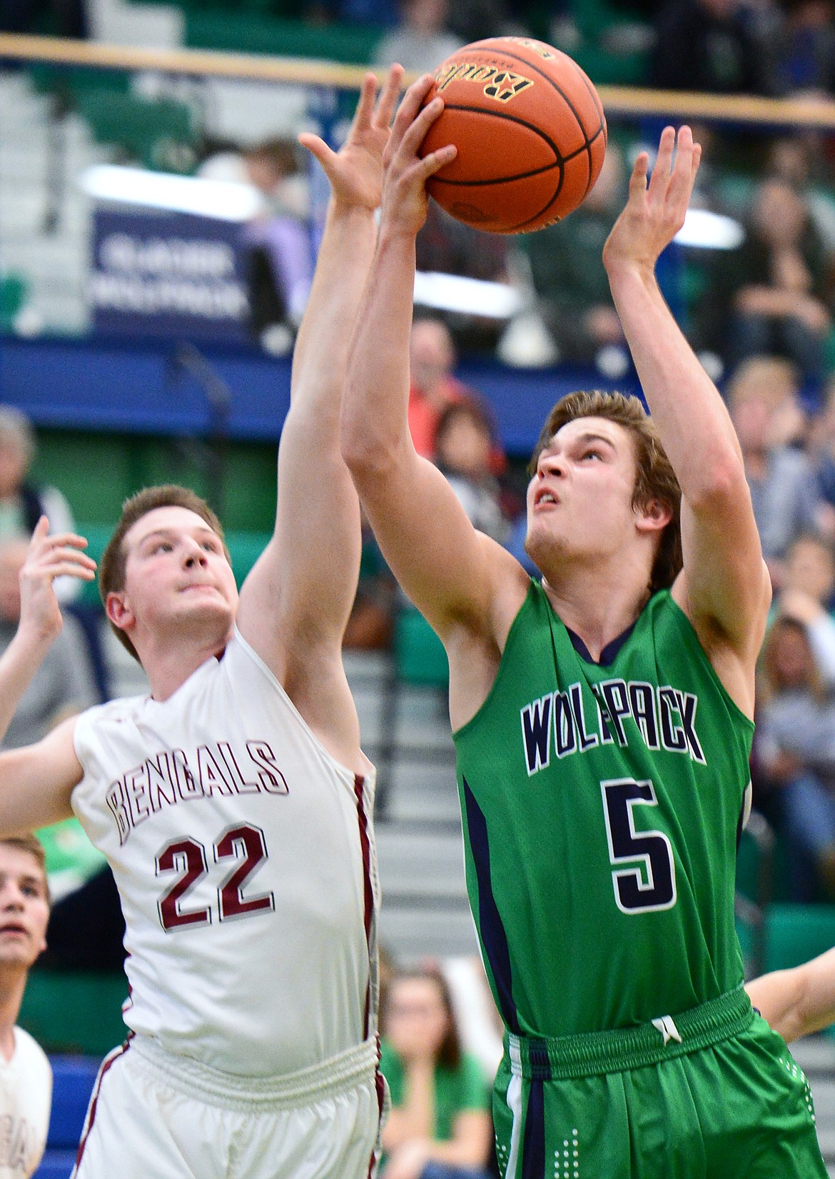 Glacier's Ethan Baines (5) powers to the hoop against Helena High's Carson Woodland (22) during Western AA Divisional play at Glacier High School on Thursday. (Casey Kreider/Daily Inter Lake)