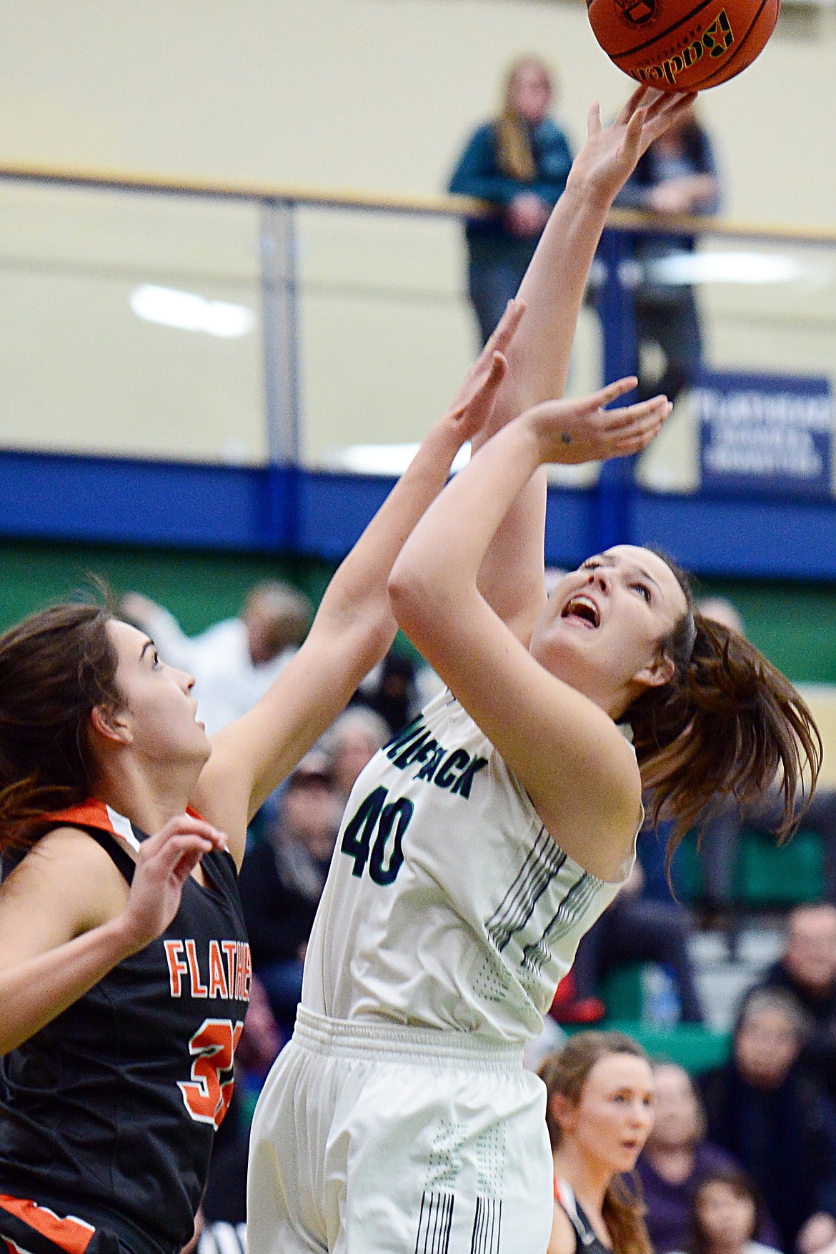 Glacier's Raley Shirey (40) looks to shoot with Flathead's Taylor Henley (32) defending during Western AA Divisional play at Glacier High School on Thursday. (Casey Kreider/Daily Inter Lake)