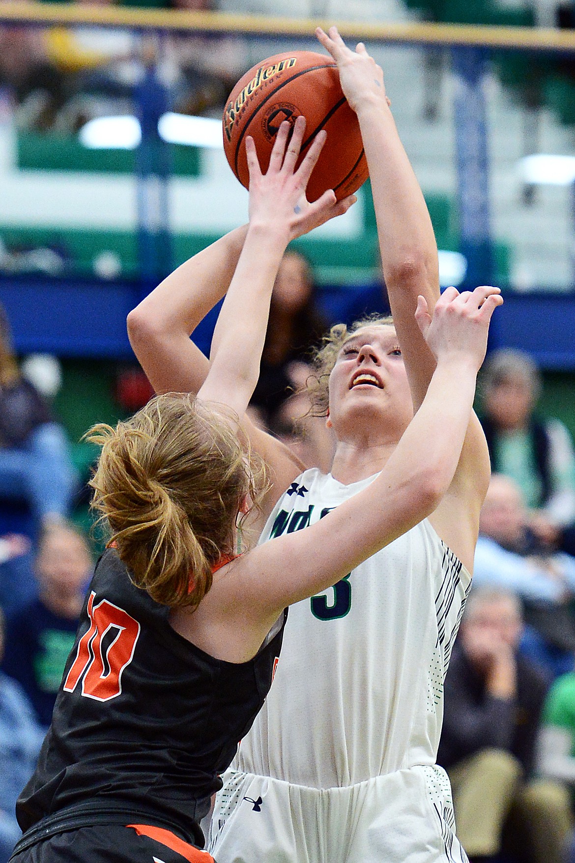 Glacier's Kali Gulick (3) looks to shoot over Flathead's Kennedy Kanter (10) during Western AA Divisional play at Glacier High School on Thursday. (Casey Kreider/Daily Inter Lake)
