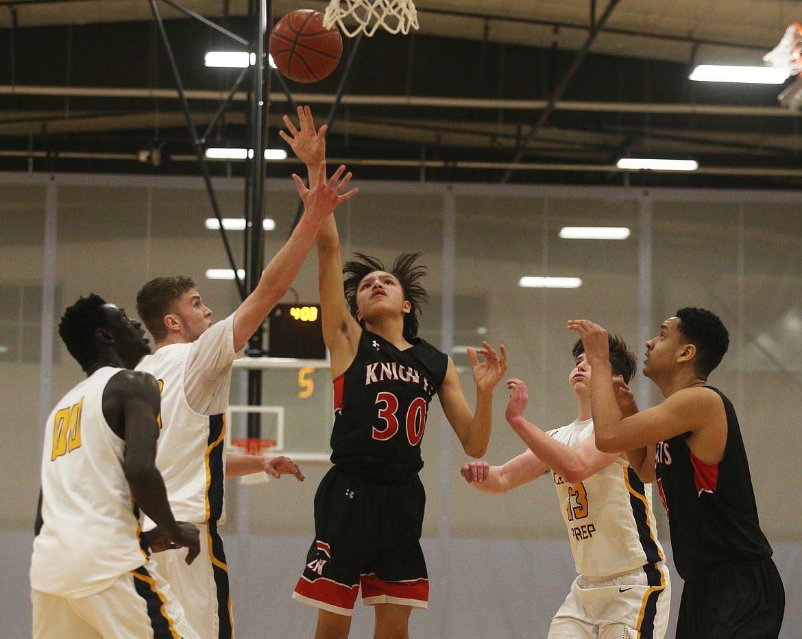 Lakeside&#146;s Kenyon SpottedhHorse goes for the layup in the fourth quarter of Friday night&#146;s 1A Division II District 1 championship game against Genesis Prep at The Courts in Post Falls. (LOREN BENOIT/Press)