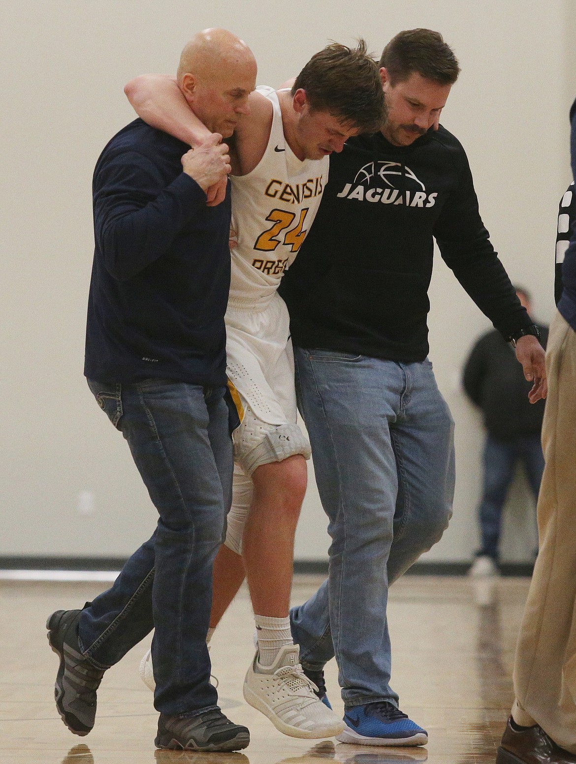 LOREN BENOIT/Press photos
Genesis Prep&#146;s Jonny Hillman is helped back to the bench after suffering a leg injury in the third quarter of Friday night&#146;s 1A Division II District 1 championship game against Lakeside. Hillman returned to the game in the fourth quarter.