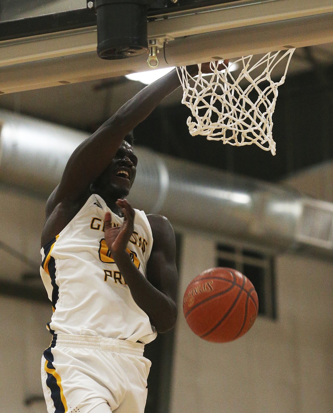 Kon Ajang of Genesis Prep dunks the ball against Lakeside in Friday night&#146;s 1A Division II District 1 championship game at The Courts in Post Falls. (LOREN BENOIT/Press)