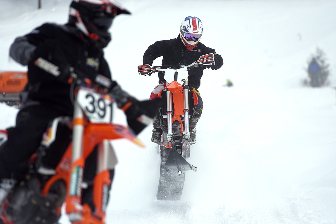 Snow bike racers take warm up laps prior to the start of Round 4 of the 509 National Championship Snow Bike Series race at the ATV park located at 6235 U.S. 93, north of Whitefish, on Saturday, Feb. 23. Racing action continues at 10 a.m. next Saturday, March 2, with the Montana Mayhem Offroad Racing Series Frostbite Frenzy ATV/UTV race. (Casey Kreider/Daily Inter Lake)