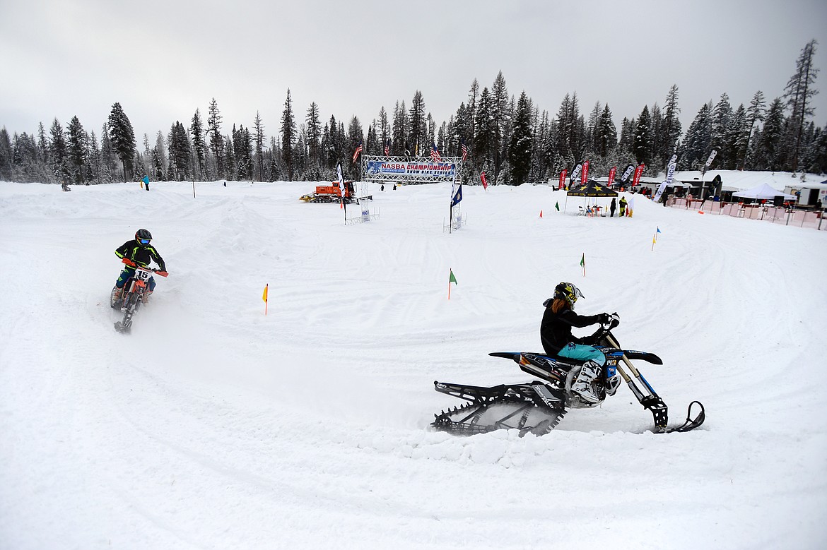 Snow bike racers take warm up laps prior to the start of Round 4 of the 509 National Championship Snow Bike Series race at the ATV park located at 6235 U.S. 93, north of Whitefish, on Saturday, Feb. 23. Racing action continues at 10 a.m. next Saturday, March 2, with the Montana Mayhem Offroad Racing Series Frostbite Frenzy ATV/UTV race. (Casey Kreider/Daily Inter Lake)