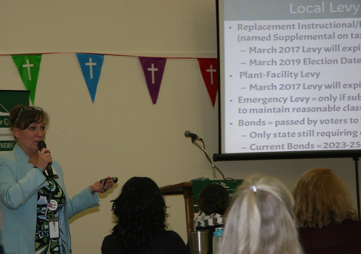 Becky Meyer, left, superintendent of the Lakeland Joint School District, speaks during the Rathdrum Area Chamber of Commerce's State of the Community Luncheon at Shepherd of the Hills Lutheran Church on Thursday. (BRIAN WALKER/Press)