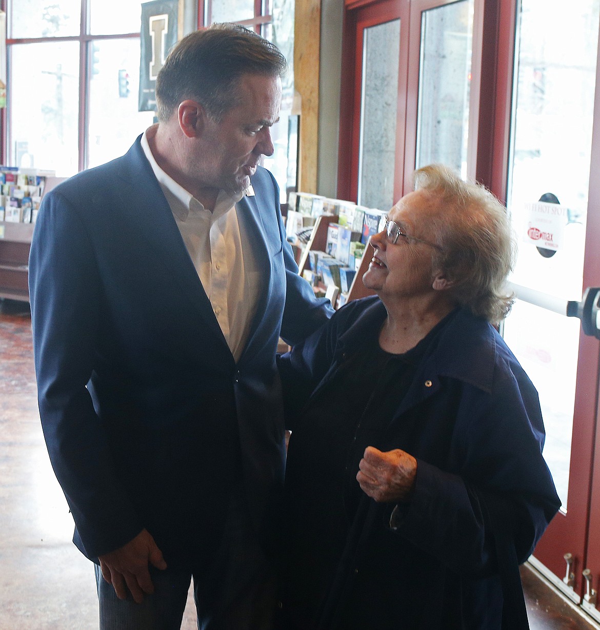 New Idaho GOP Congressman Russ Fulcher greets Coeur d'Alene resident Ruthie Johnson, 94, as he visits with locals at the Coeur d'Alene Chamber of Commerce on Wednesday. (LOREN BENOIT/Press)