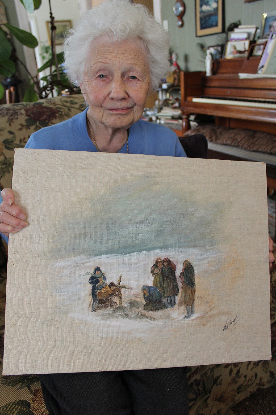 Alicja Moskaluk Edwards of Eureka painted the illustrations for her memoir &#147;And God Was Our Witness,&#148; which describes the ordeals she and her family endured after being deported from Poland by Soviet Russia. This painting portrays the burial in Kazakhstan of her grandmother, who died of starvation. (Duncan Adams/Daily Inter Lake)