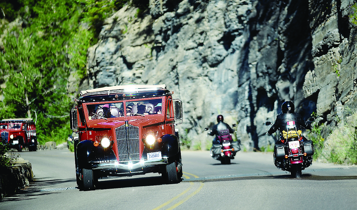 Red buses filled with visitors make their way up Going-to-the-Sun Road on Wednesday, July 29, in Glacier National Park.
(Brenda Ahearn/Daily Inter Lake FILE)