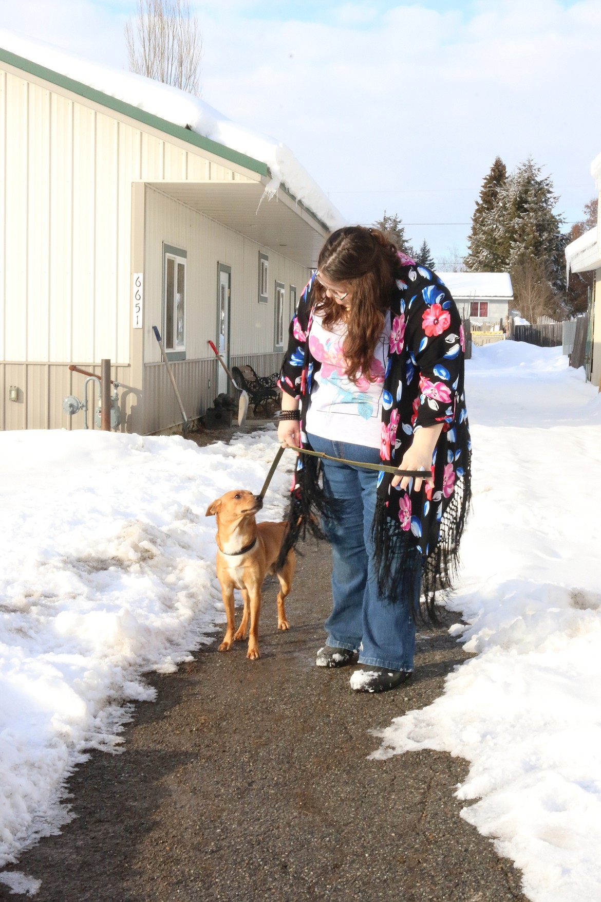 Photo by MANDI BATEMAN
Shelter Staff Carla Clark with Tuck, the dog.