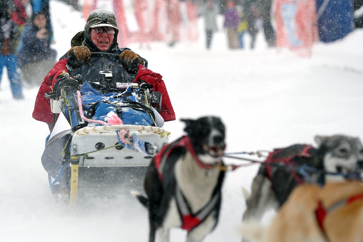 A musher leads his six-dog team out onto the course at the Flathead Classic at Dog Creek Lodge in Olney on Saturday, Feb. 23. (Casey Kreider/Daily Inter Lake)