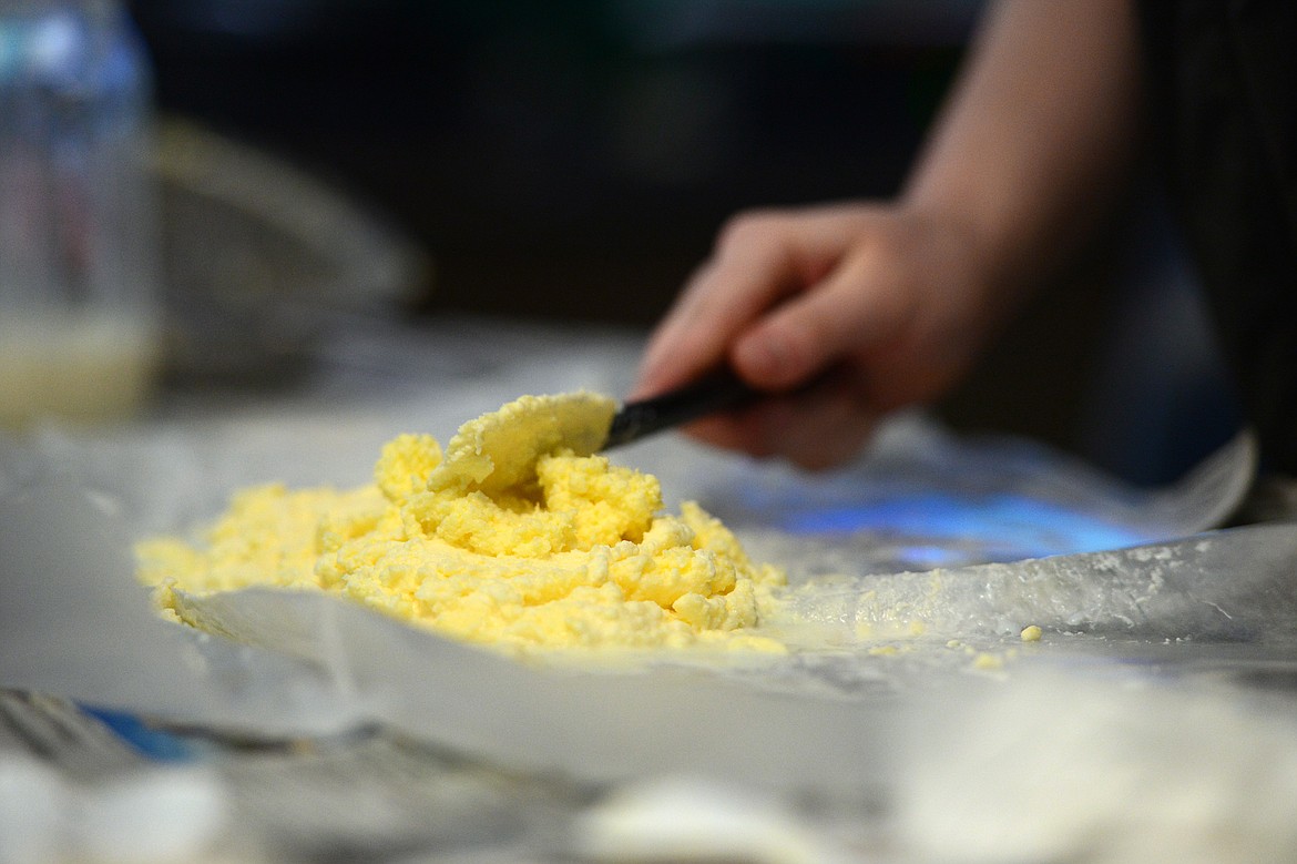 Eighth-grader Ava Chorn molds the butter on a piece of wax paper in Kris Schreiner&#146;s Montana History class at Kalispell Middle School on Tuesday, Feb. 19. (Casey Kreider/Daily Inter Lake)