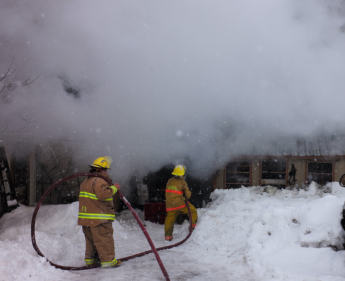 Firefighters from Hungry Horse-Martin City and Bad Rock battled a house fire Thursday off Central Avenue. The house was completely engulfed when the call came in. (Chris Peterson photo)