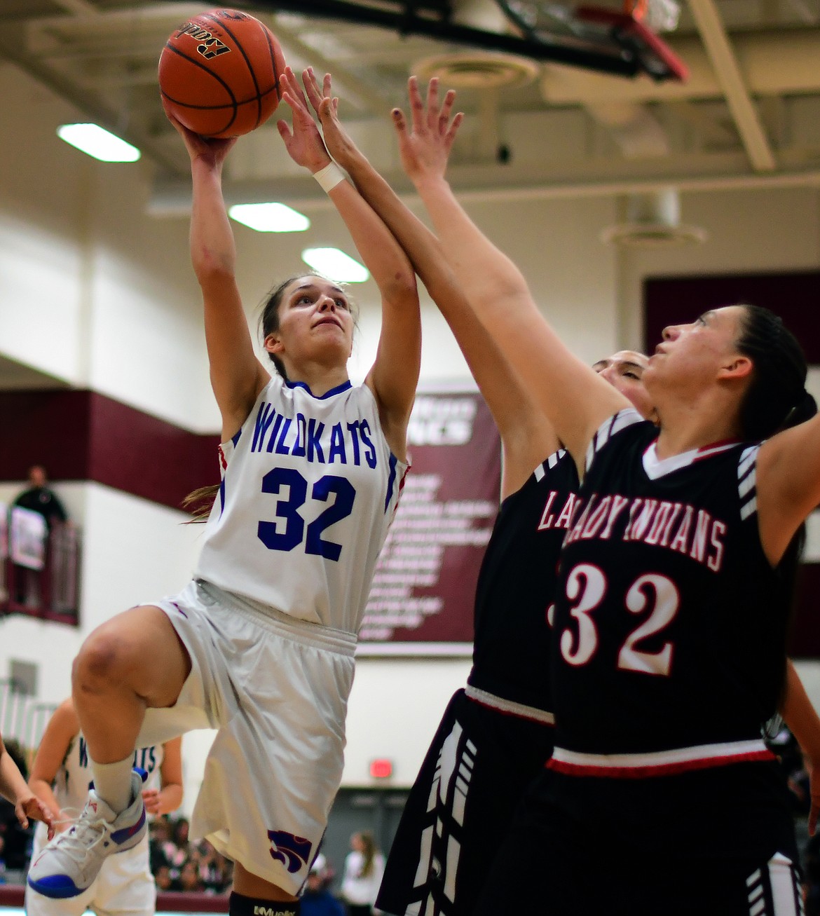 Madison Hoerner goes up over Browning&#146;s Taylor Jordan in the third quarter Saturday. (Jeremy Weber photo)