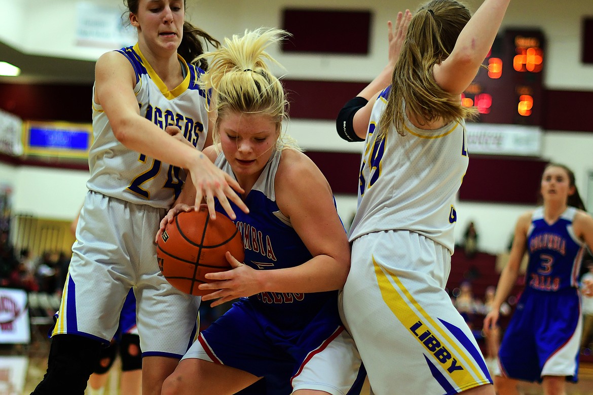 Trista Cowan battles Libby&#146;s Jayden Winslow for a rebound in the third quarter Friday. (Jeremy Weber photo)