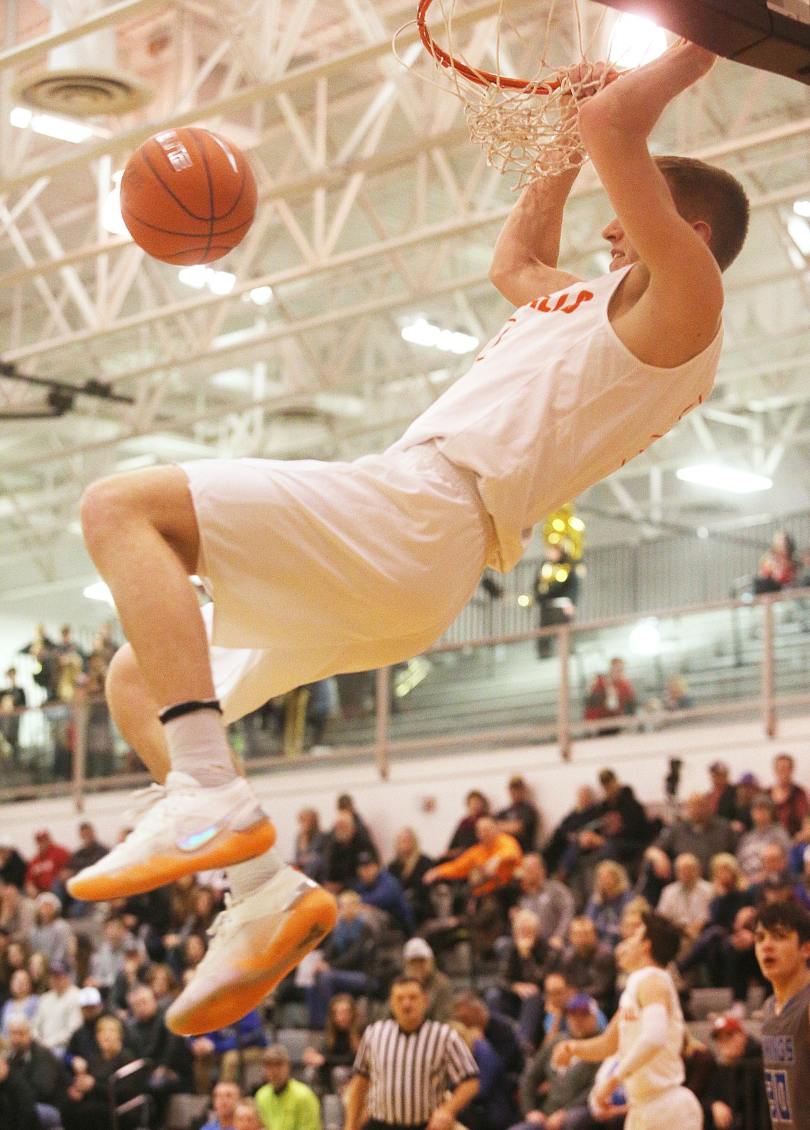 LOREN BENOIT/Press 
Post Falls&#146; Colby Gennett dunks the ball against Coeur d&#146;Alene in the 5A Region 1 tournament championship game Tuesday night in Post Falls.