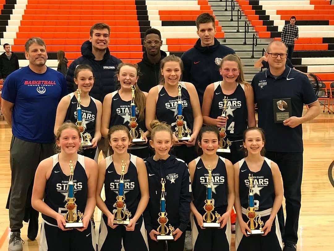 Courtesy photo
The North Idaho Stars seventh-grade girls won the Spokane AAU Basketball league for the 2018-19 season on Sunday at West Valley High in Spokane. In the front row from left are Kelsey Carroll, Kylin Chavez, Ava Yates, Madison Mitchell and Ella Terzulli; second row from left, Sam Beamis, Olivia Naccarato, Kamryn Curry, Jenacy Johnson and coach Eli Yates; and back row from left, coach John Naccarato and Gonzaga&#146;s Corey Kispert, Joel Ayayi and Filip Petrusev. The Zags were there to congratulate the teams and hand out trophies.