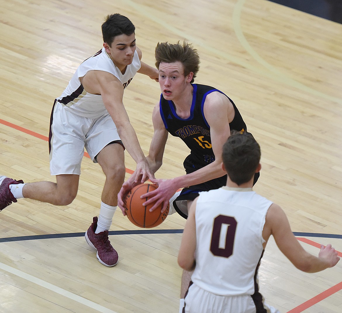 THOMPSON FALLS senior Grant Lundberg takes to ball to the basket during last Friday&#146;s consolation game in the Western B Divisional Tournament in Ronan. Lundberg netted 14 points and had nine rebounds in his high school career finale. (Joe Sova photos/Clark Fork Valley Press)