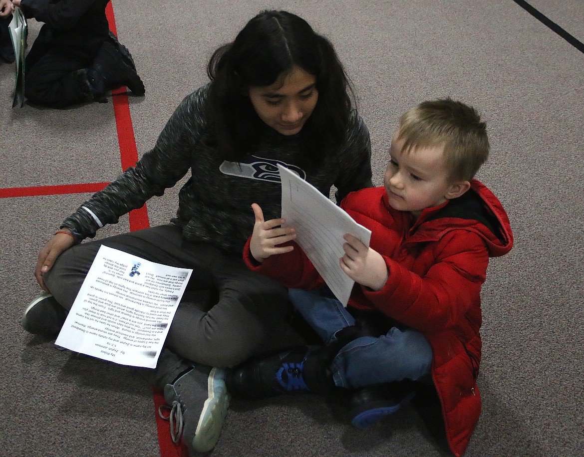 (Photo by MARY MALONE)
Idaho Hill Elementary students read to each other from the writings they did in class during the school&#146;s writing challenge assembly on Friday.