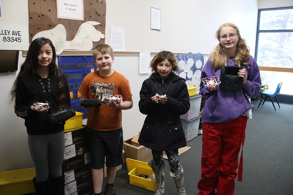 (Photo by MARY MALONE)
Idaho Hill Elementary sixth-graders Athena Welker, Hunter Rose, Tyler Cooper and Autumn Sedgwick recently learned all about drones, from how to fly them to how to fix them.