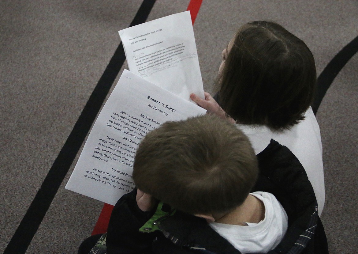 (Photo by MARY MALONE)
Idaho Hill Elementary students read to each other from the writings they did in class during the school&#146;s writing challenge assembly on Friday.